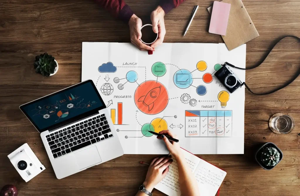 mesa de trabajo con portatil y gráficos
